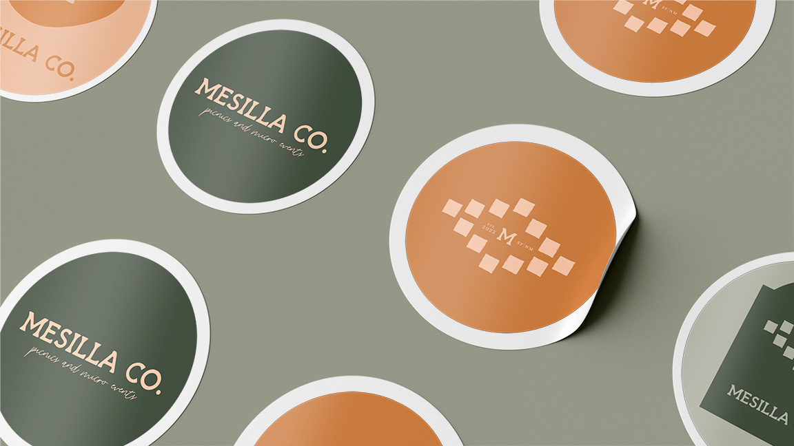 A mock-up of stickers, give customers something to remember your business during the consideration phase, for Mesilla Co. Picnics and Micro Events designed by Kin & Co. Design Studio a strategic brand and website designer.